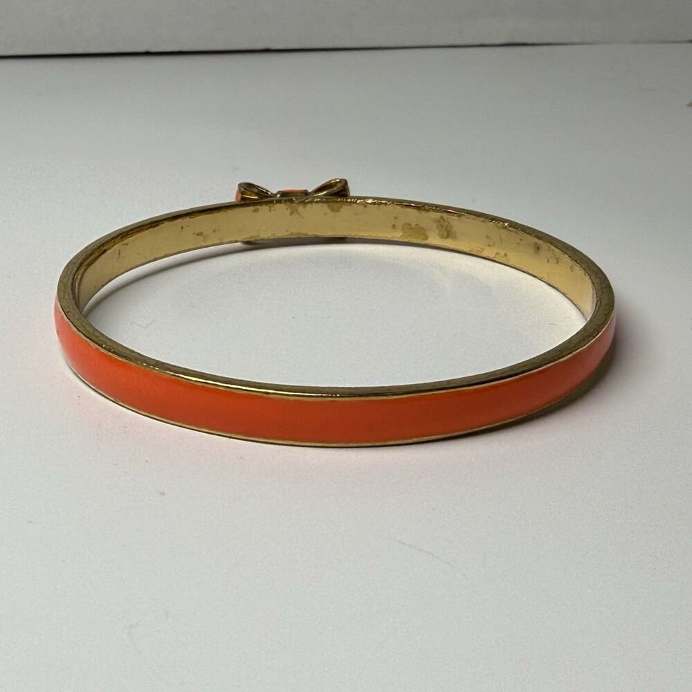 Kate Spade New York Skinny Gold And Orange Enamel Bangle Bow Bracelet - Picture 6 of 8